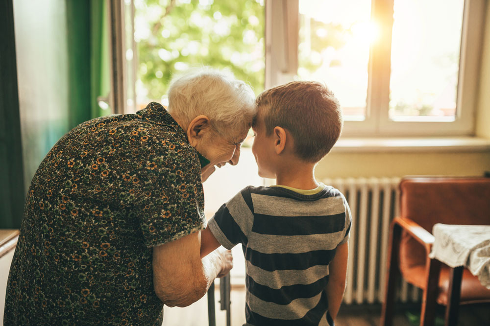 Memory Care resident grandfather with his grandson