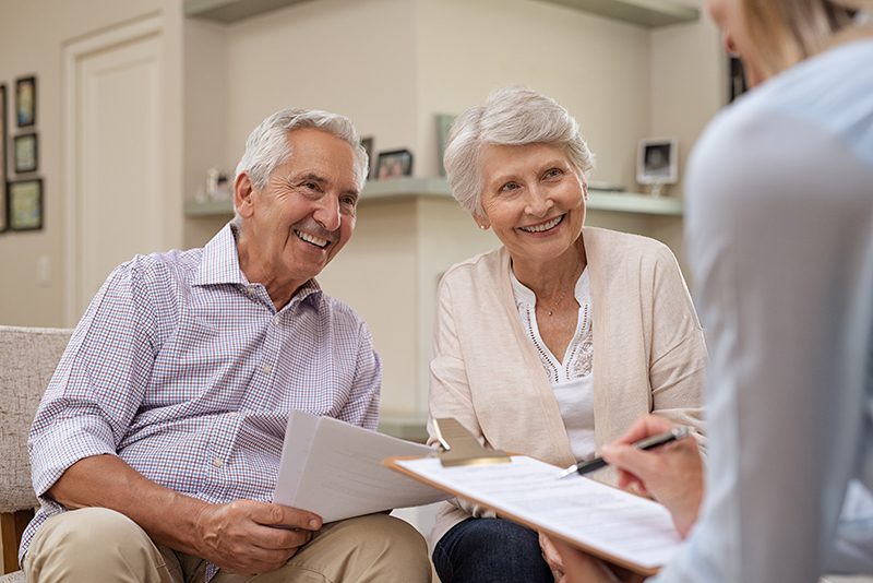 Couple consulting with a team member at Charter Senior Living of Newport News, VA