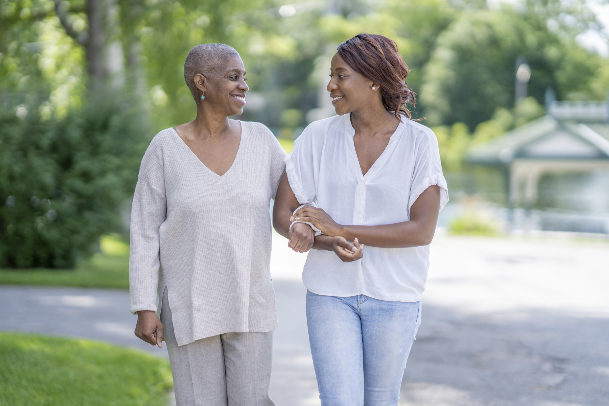 Senior woman walking with adult child